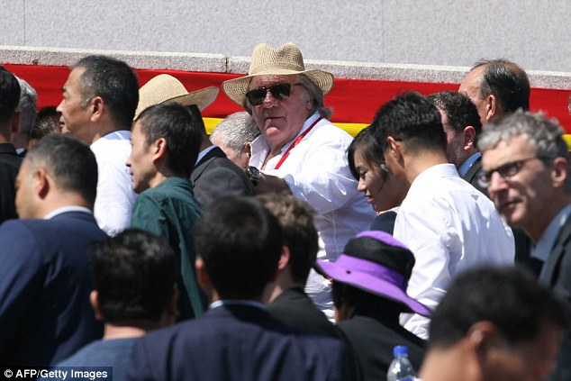French actor Gerard Depardieu attends a military parade and mass rally on Kim Il Sung square in Pyongyang, North Korea, on Sunday