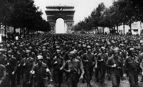 American soldiers march along the Champs Elysees to liberate Paris: The end of the occupation began a backlash against brothels