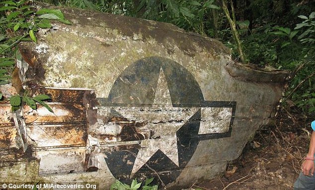 Final resting place: The wing of a C-109 bulk fuel transport plane appears out of the dense jungle. This plane went down over the Hump on July 17, 1945