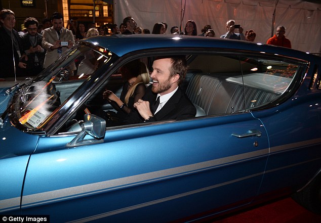 Not quite a superstar yet: It looked as though Aaron had driven himself and Lauren to the premiere... although it was perhaps a car used to promote speed racing flick