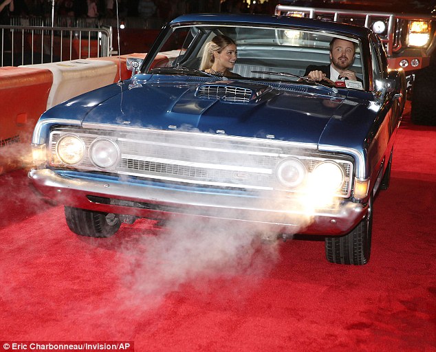 Need for speed? Not in that old thing! Aaron Paul and his wife Lauren come to a premature halt on the red carpet at the premiere of A Need For Speed