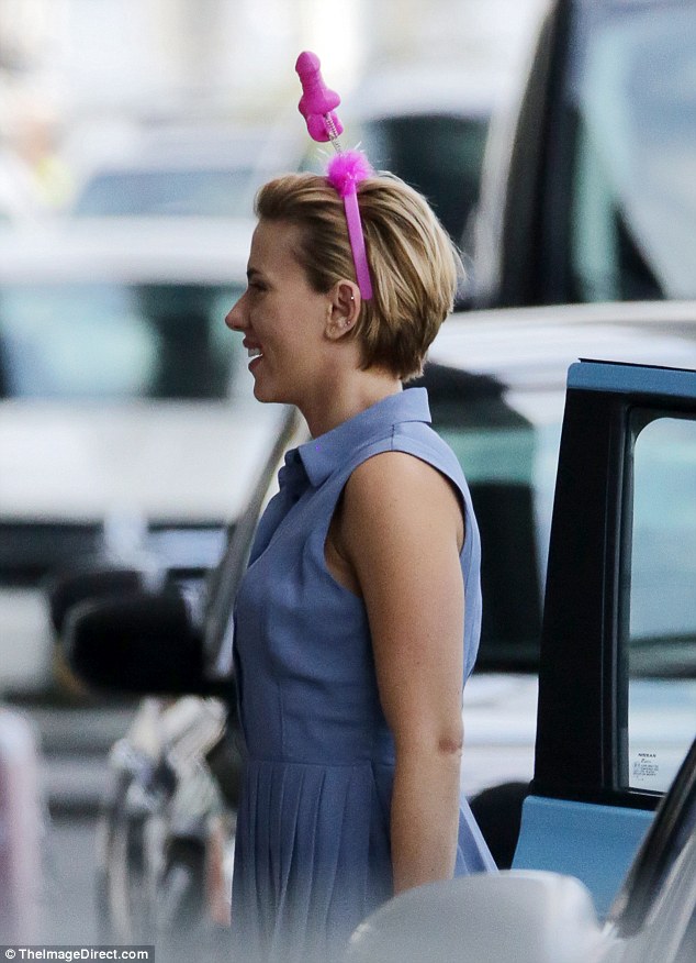 Action! Scarlett Johansson wore a hot pink sex toy headband as she filmed raunchy comedy Rock That Body at JFK airport in New York City on Monday