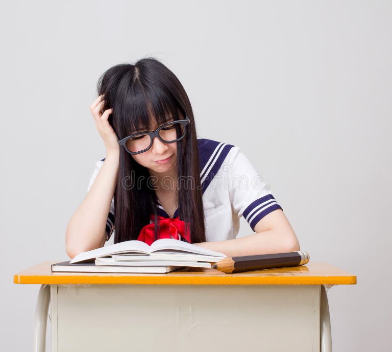 Asian girl student in school study hard uniform japanese style. Is asian girl student in school study hard uniform japanese style royalty free stock photos