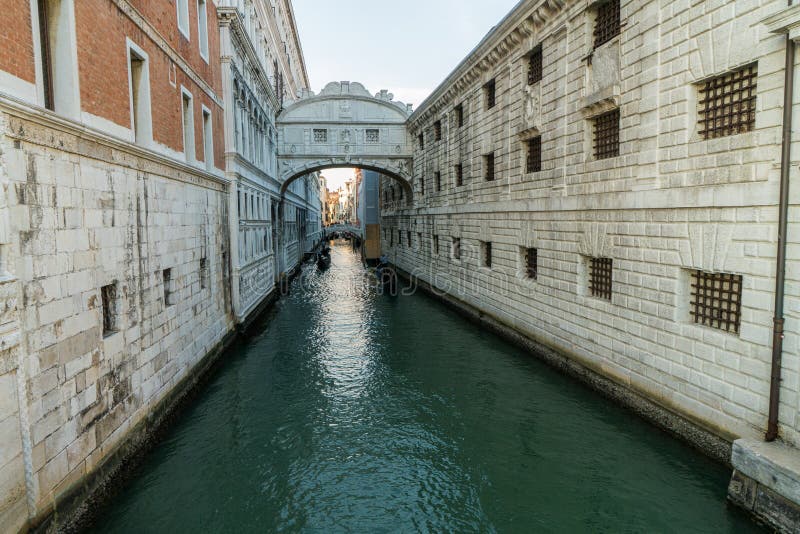 The Bridge of Sighs, famous bridge connects the Doge’s Palace to the prison, in Venice, Italy with gondolas.  royalty free stock photos