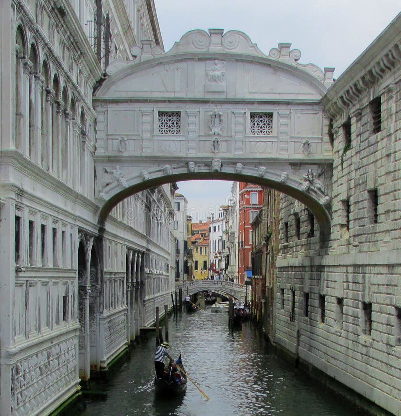 Bridge of Sighs, Ponte dei Sospiri, Venice Italy. A gondolier glides under the Bridge of Sighs, known as the Ponte dei Sospiri, in Venice Italy. The white royalty free stock photos