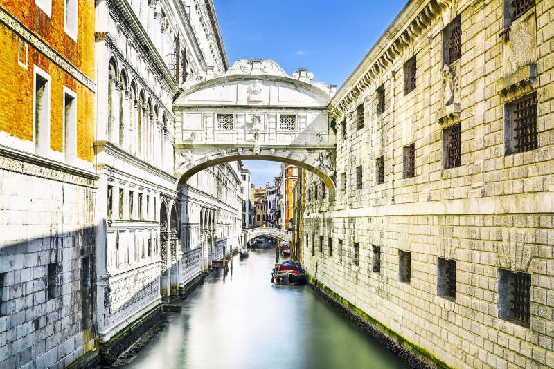 Bridge of Sighs in Venice, Italy. Gondolas passing under the Bridge of Sighs - Ponte dei Sospiri. A legend says that lovers will be granted eternal love if they stock photo