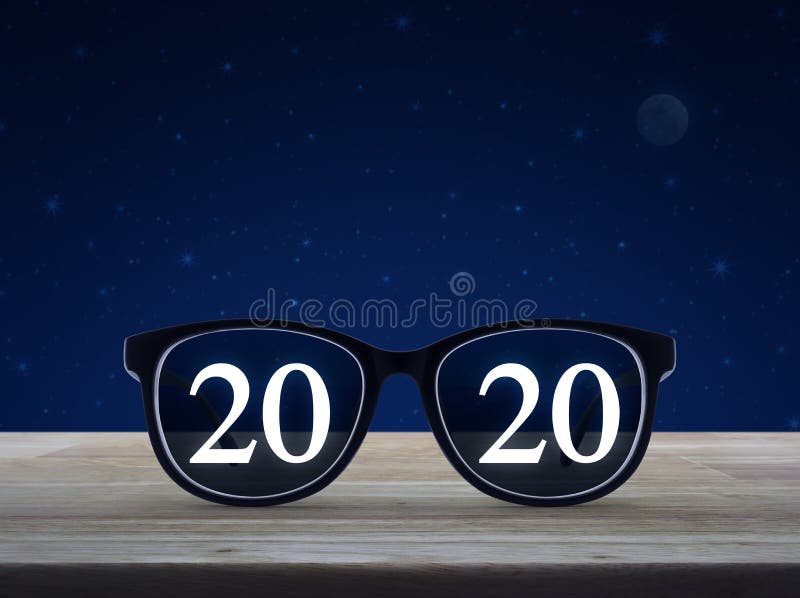 Business vision happy new year 2020 concept. 2020 white text with black eye glasses on wooden table over fantasy night sky and moon, Business vision happy new royalty free stock photo