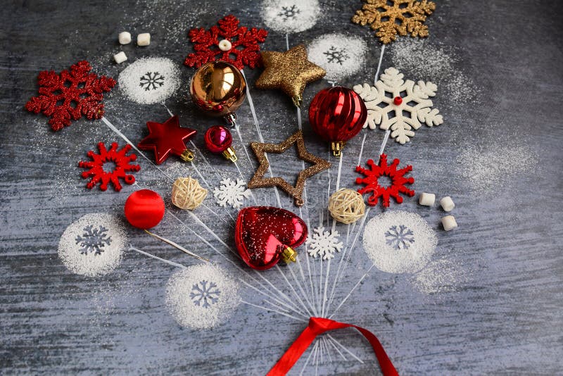 Fantasy on the theme of the New Year. Christmas balls, snowflakes, stars in the form of balloons tied with a red ribbon on a blue. Fantasy on the theme of the royalty free stock photos
