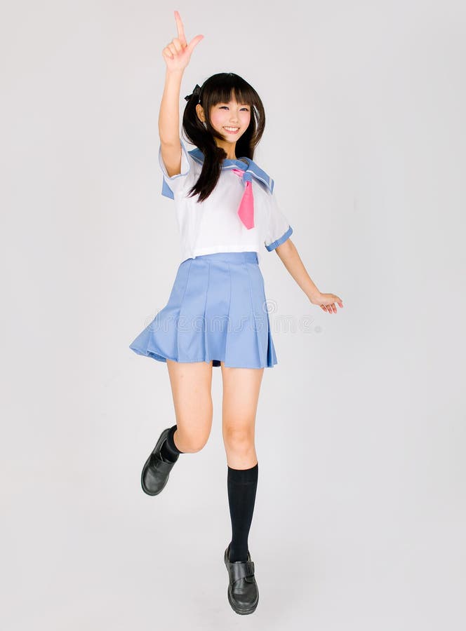 Japanese cute teen school girl. Its a asia/japanese cute teen school girl in pink background stock photography