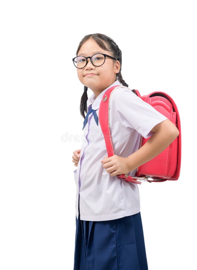 Portrait of cute asian girl student  wear uniform and carries school bag. Isolated on white background, back to school amd education concept stock images