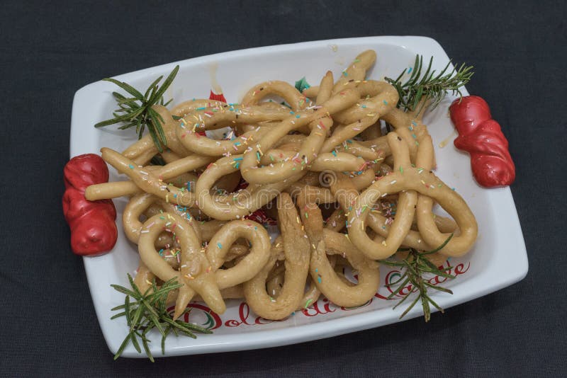Scavuratielli, Christmas sweets of italian tradition. Cilento food. Fried donuts covered in honey stock image