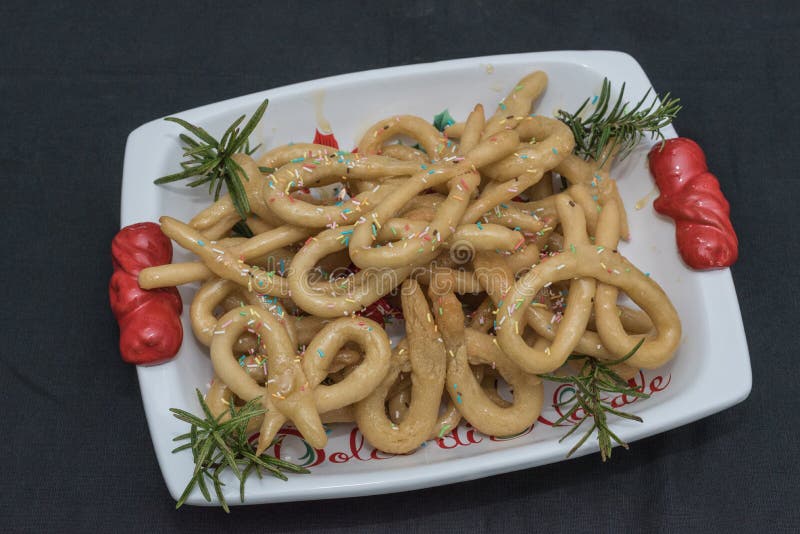 Scavuratielli, Christmas sweets of italian tradition. Cilento food. Fried donuts covered in honey stock photography
