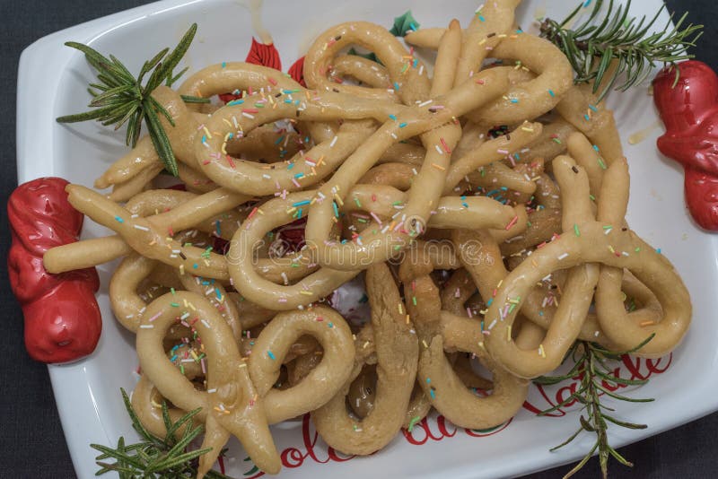 Scavuratielli, Christmas sweets of italian tradition. Cilento food. Fried donuts covered in honey stock photography