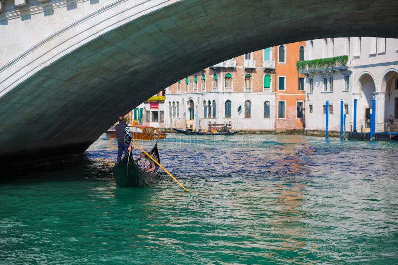 Traditional Gondolas passing over Bridge of Sighs in Venice, Italy stock photos