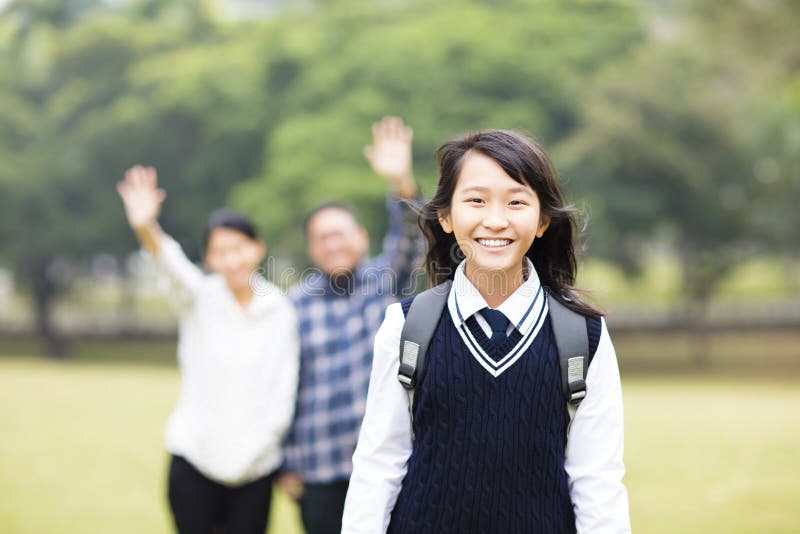 Young student girl with parent in school. Cute young student girl with parent in school royalty free stock image