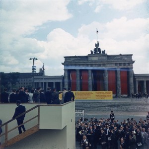 Berlin Quotes: Ich bin ein Berliner by John F. Kennedy - Photo: Kennedy at the Berlin Wall / Wall Brandenburg Gate, 1963
